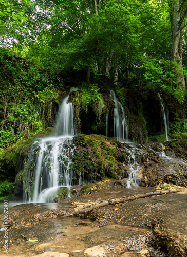 Beautiful waterfall in the forest in spring