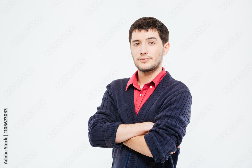 Handsome man standing with arms folded Handsome man standing with arms folded
