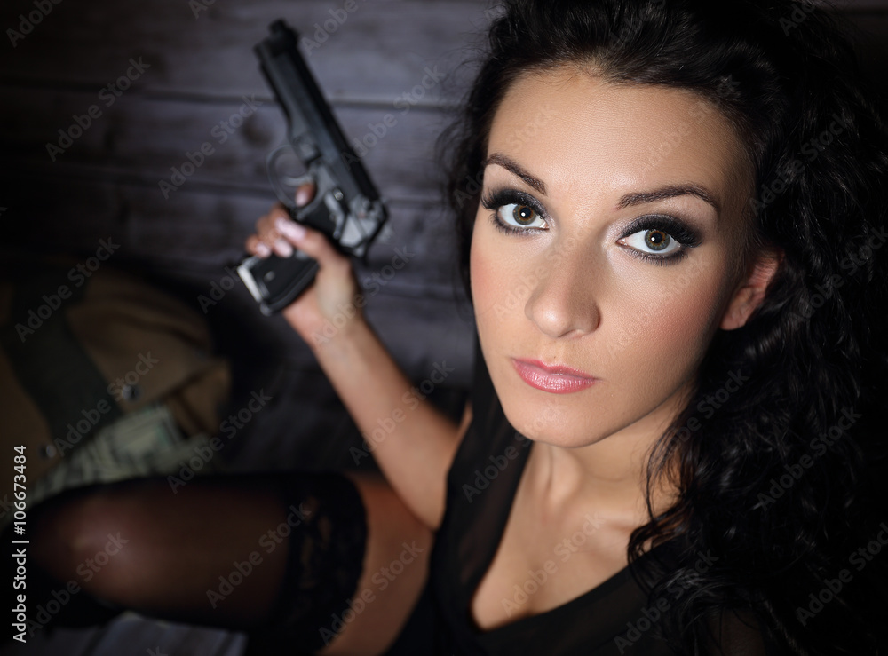 Pretty girl with a gun