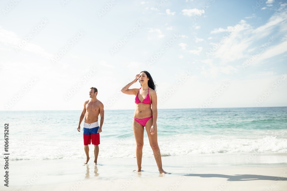 Young couple standing on beach