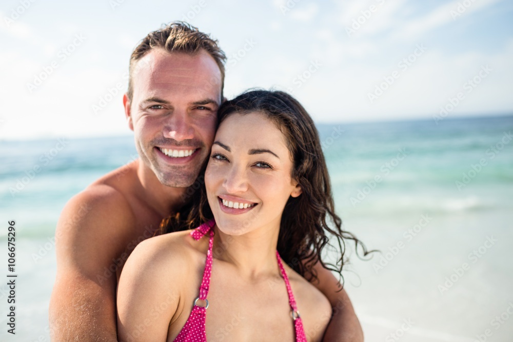 Portrait of happy couple embracing each other