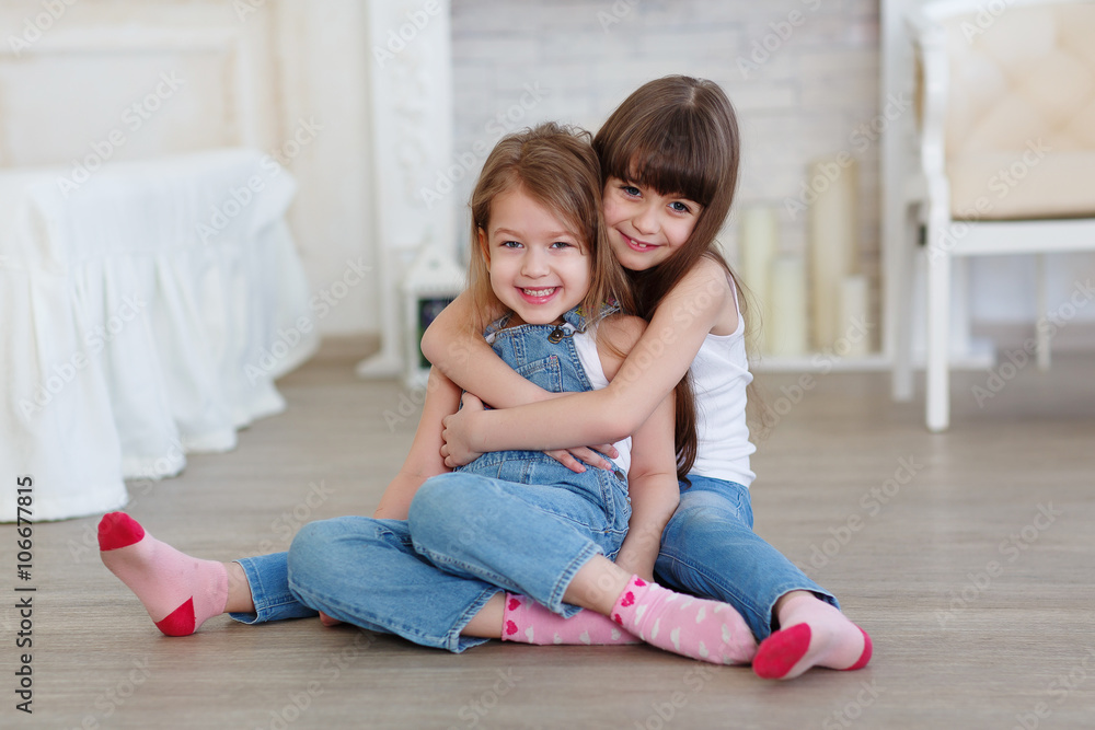 little girls hugging and laughing little girls hugging and laughing