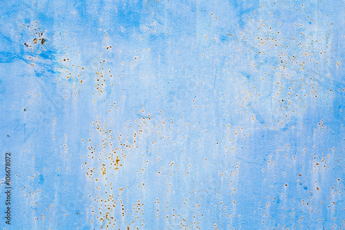 Old blue cracked paint on metal background