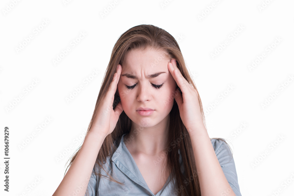 Young woman with a headache holding head Young woman with a headache holding head