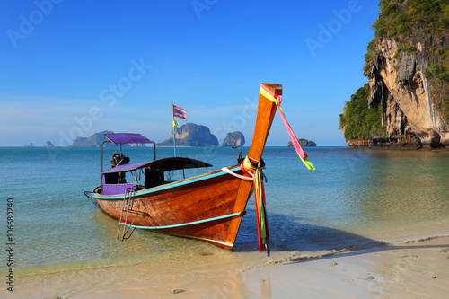 Long tail boat on tropical beach (Pranang beach) and rock, Krabi © Kokhanchikov