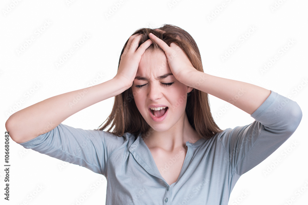 Young woman with a headache holding head Young woman with a headache holding head