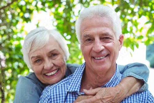 Fotografie Confident retired couple embracing