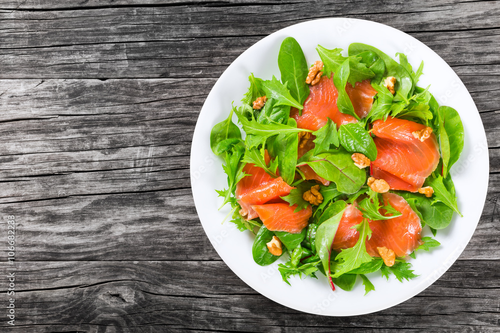 Red fish healty salad on white dish Red fish healty salad on white dish