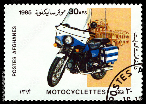 Postage stamp. Motorcycle and Coliseum.