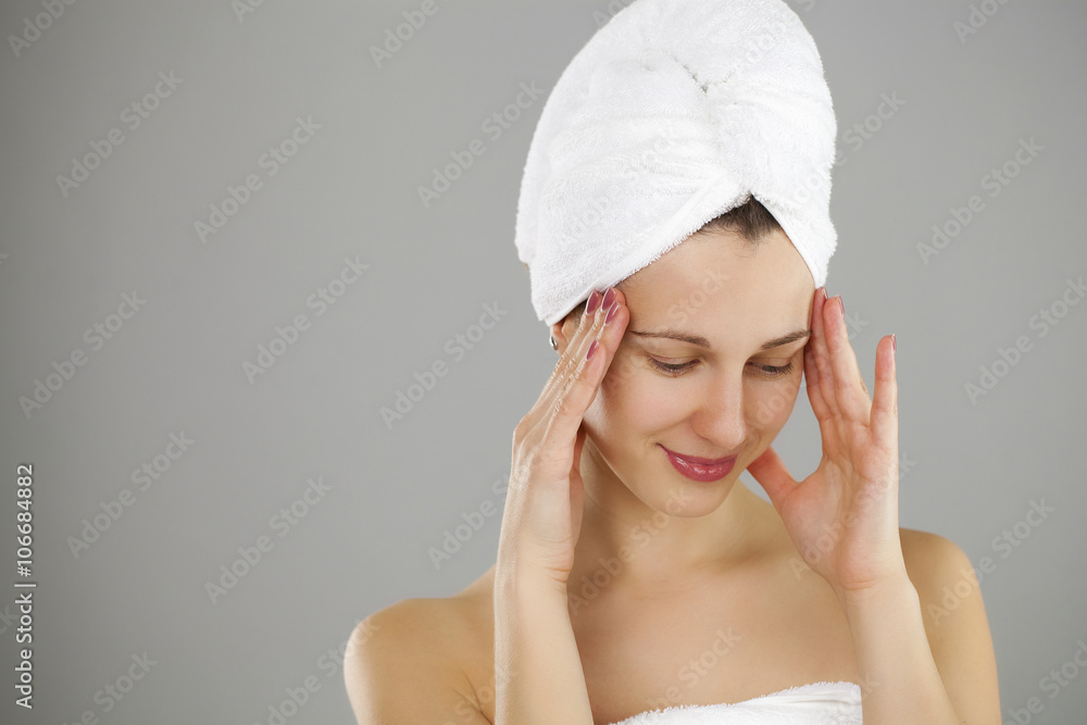 Beautiful young woman posing in white towel Beautiful young woman posing in white towel