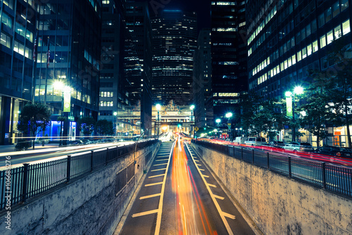 night city view with blurs of passing cars