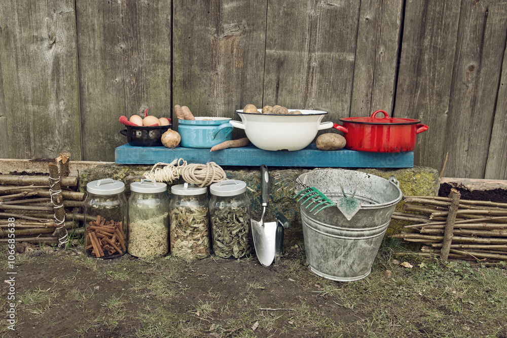 Healthy Food in Kitchen Pots with Dry Herbs in Glass Bottles on Wooden Background Healthy Food in Kitchen Pots with Dry Herbs in Glass Bottles on Wooden Background