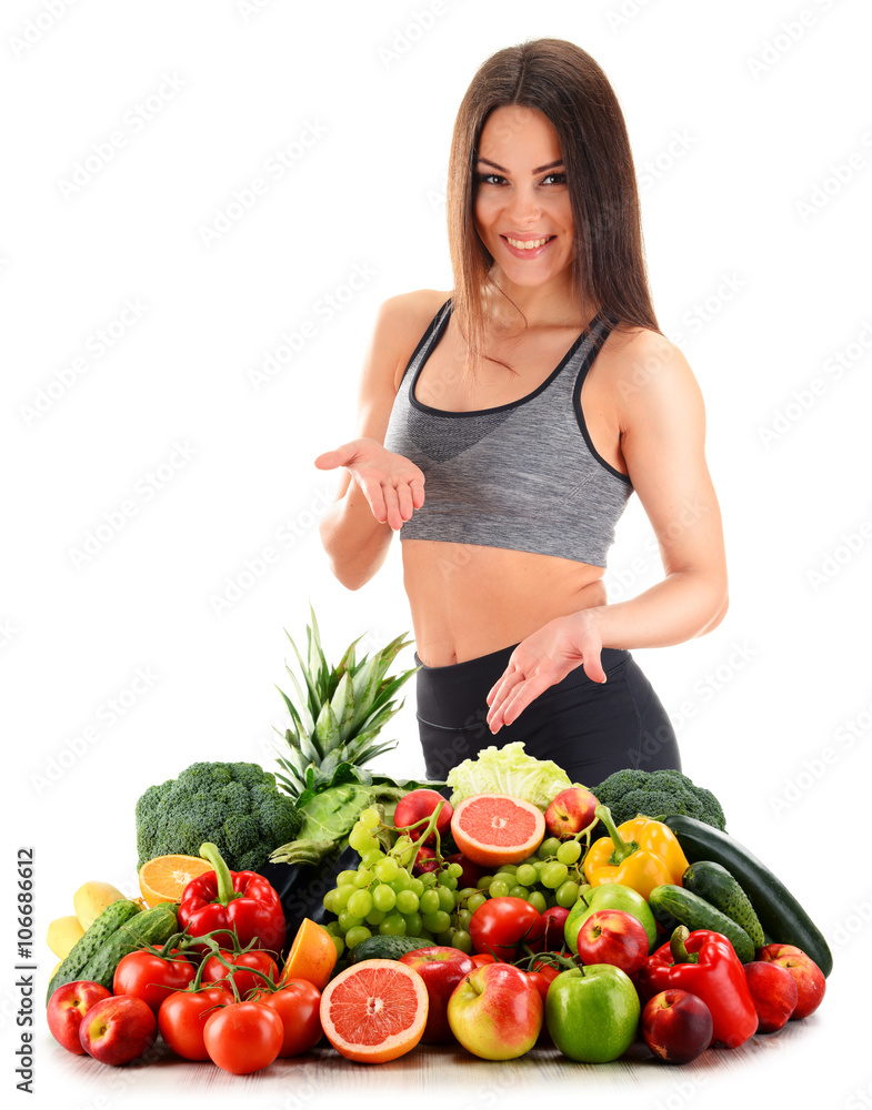 Young woman with variety of organic vegetables and fruits Young woman with variety of organic vegetables and fruits