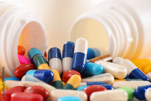 Composition with variety of drug pills and container photo