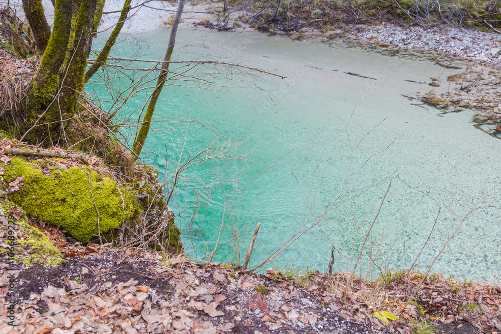 Mossy bank of clean and pure emerald river, Idrija, Slovenia. Mossy bank of clean and pure emerald river, Idrija, Slovenia.