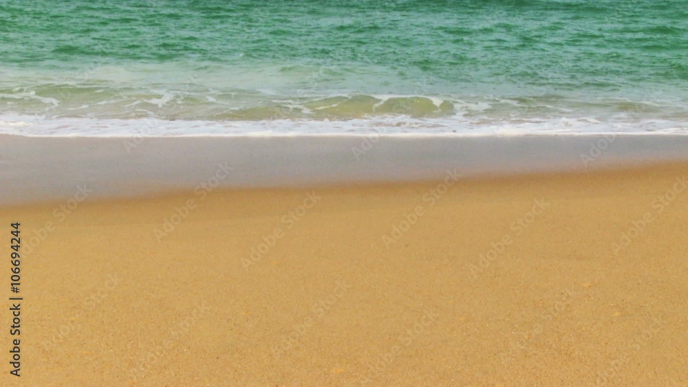 Tropical sand beach and sea waves