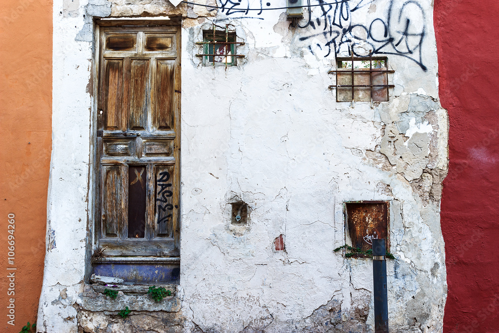 Grunge weathered facade, old abandoned ruin entrance at Es Jonquet neighborhood, Palma de Mallorca