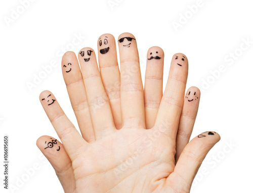 close up of hands and fingers with smiley faces