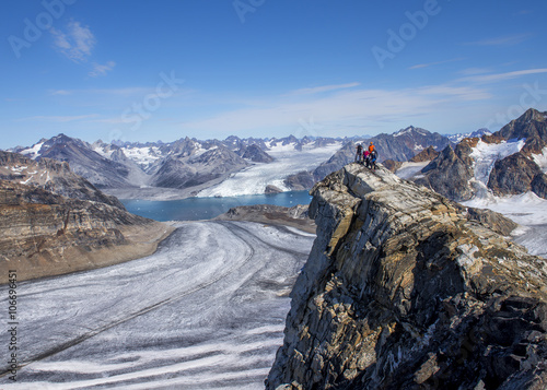 Greenland, Kulusuk, Mountaineers in the Schweizerland Alps photo