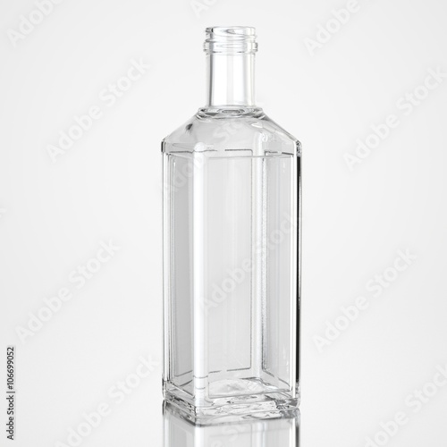 Glass bottle on white background