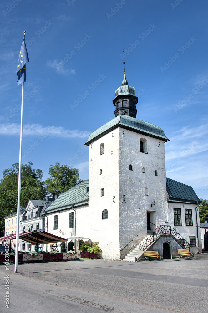 Old town hall of Vadstena Sweden and flag of Europe Old town hall of Vadstena Sweden and flag of Europe