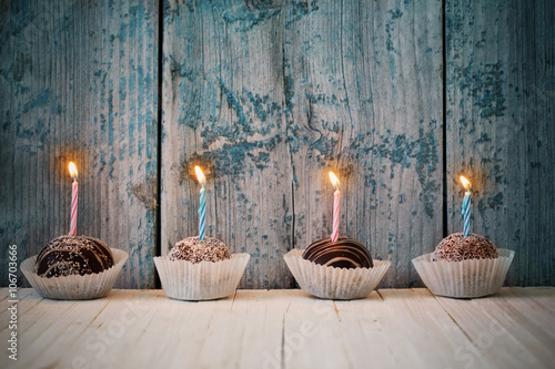 birthday cupcakes on wooden background