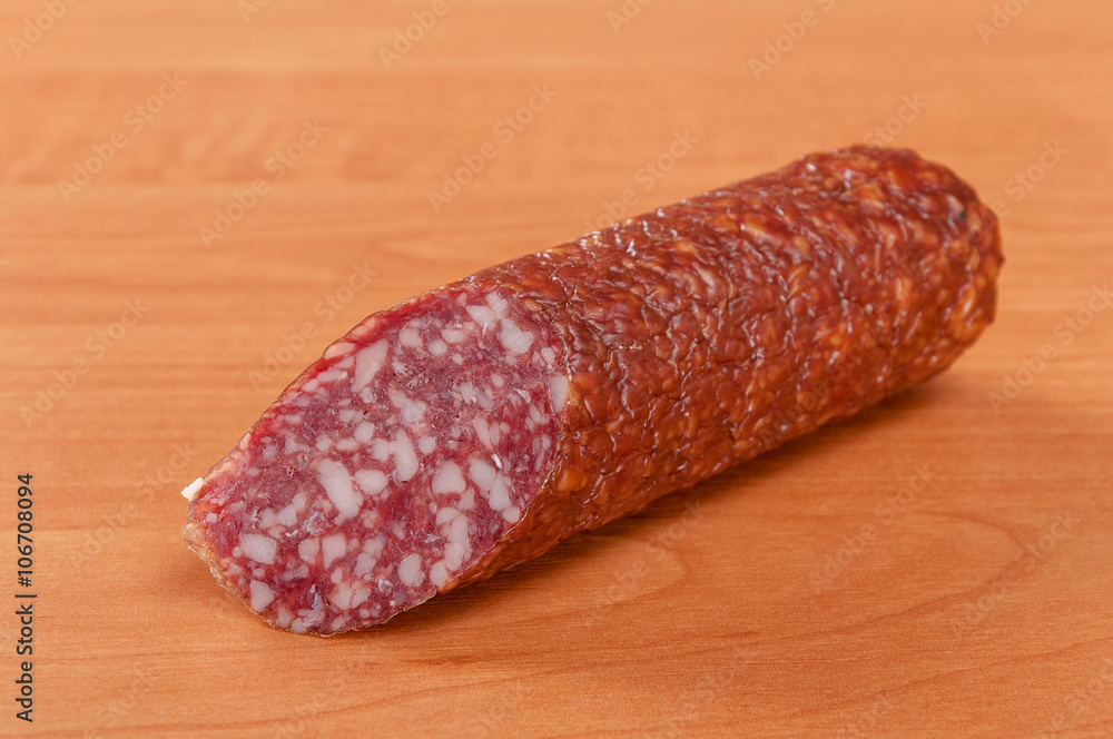 Salami for Breakfast with pepper on a wooden table Salami for Breakfast with pepper on a wooden table