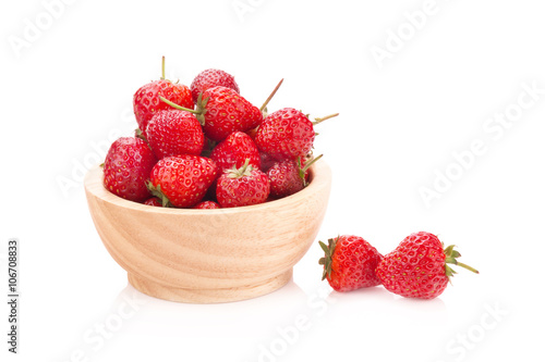 Strawberry in wood cup on white background