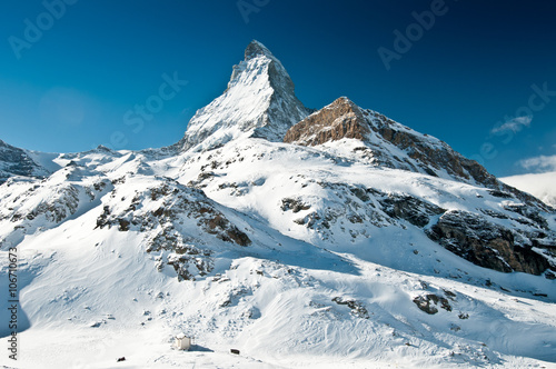 Scenic view on snowy Matterhorn peak in sunny day, Switzerland. © Ekaterina Grivet