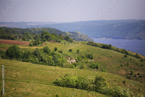 Spring sunny hills on the riverbank
