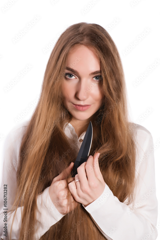 Young woman with beautiful hair and a knife in her hands Young woman with beautiful hair and a knife in her hands