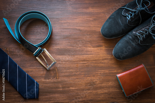 Men fashion accessories. Men wallet, belt, shoes and tie. Still life. Business look.