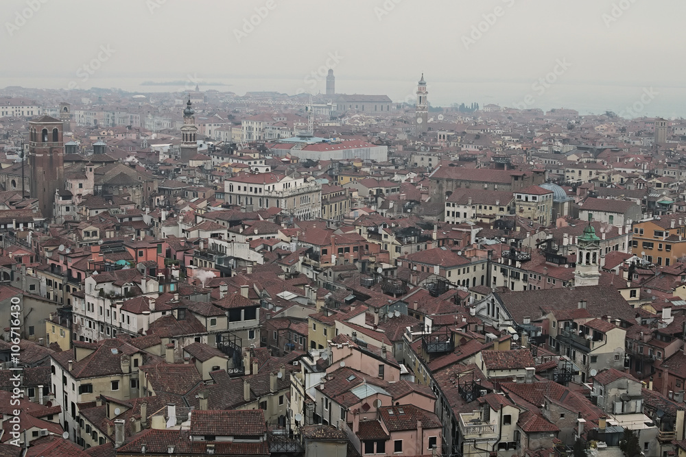 VENICE, ITALY. JANUARY 05, 2016 - Cloudy day in Venice. Drizzling light rain. View of the city from the bell tower of the Cathedral of St. Mark. The city gradually enveloping fog