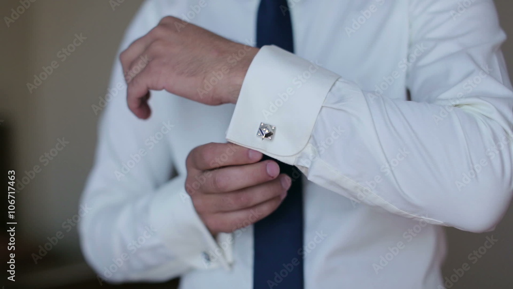 Man wear a shirt and cufflinks Man wear a shirt and cufflinks
