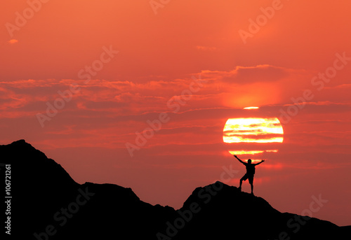 Sunset landscape with silho...