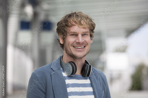 Portrait of smiling man with headphones photo