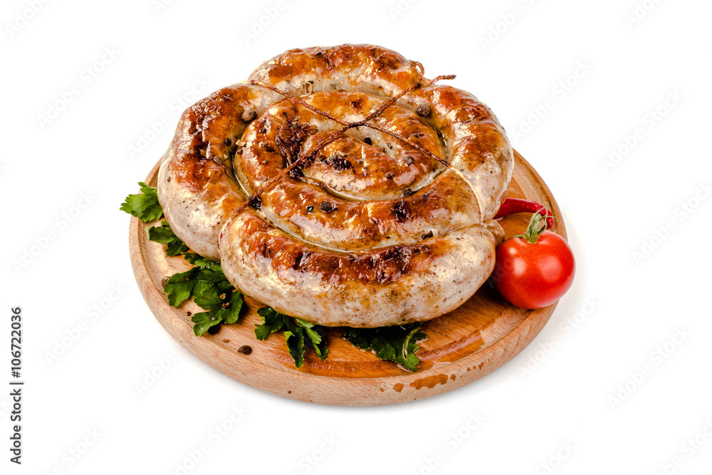 fried pork sausages on a barbecue on a wooden plate with cherry tomatoes and hot peppers fried pork sausages on a barbecue on a wooden plate with cherry tomatoes and hot peppers