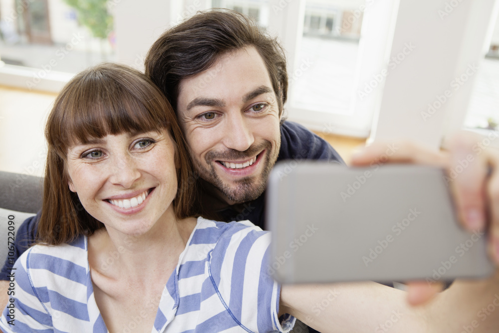 Happy couple taking selfie at home Happy couple taking selfie at home