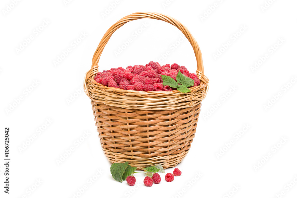 Fresh ripe red raspberries in a wicker bowl Fresh ripe red raspberries in a wicker bowl