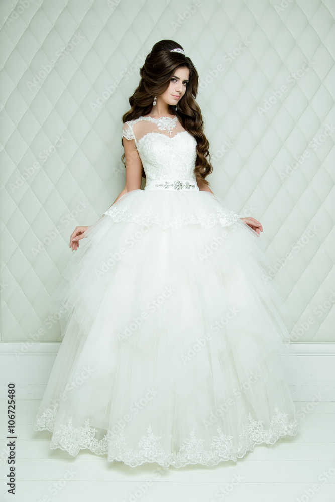 full length view on beautiful woman posing in a wedding dress. wedding makeup and hairstyle with diamond crown, fashion bride model jewelry and beauty female face, bride in luxury wedding dress, full length view on beautiful woman posing in a wedding dress. wedding makeup and hairstyle with diamond crown, fashion bride model jewelry and beauty female face, bride in luxury wedding dress,