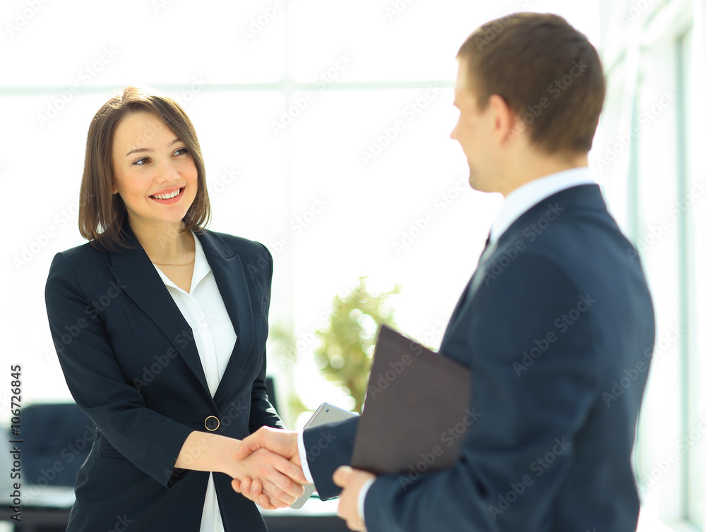 Two professional business people shaking hands Two professional business people shaking hands