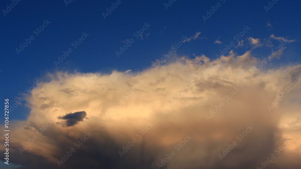 Timelapse white, orange, gray clouds on the blue background Timelapse white, orange, gray clouds on the blue background