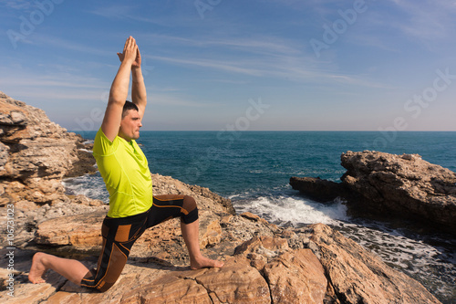Young man practicing yoga and meditating.
