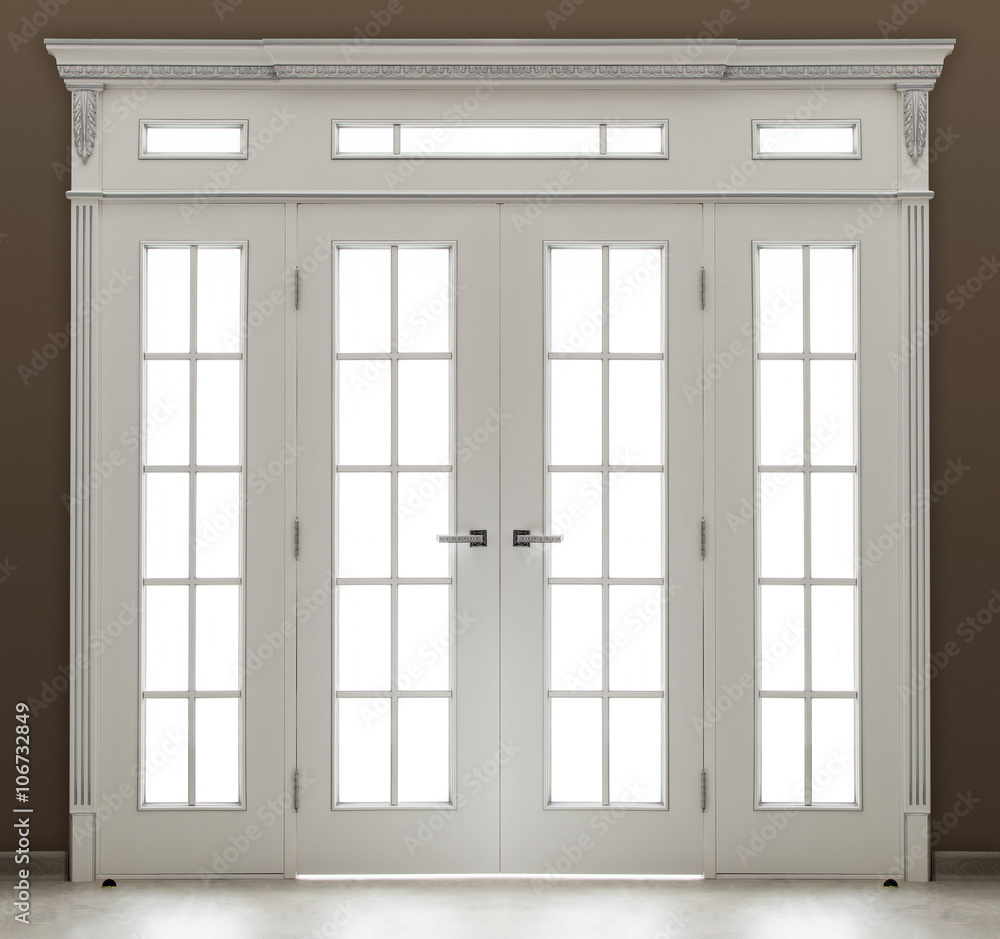 A white decorated double door with glass A white decorated double door with glass