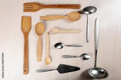 Wooden and silver cutlery set on a table