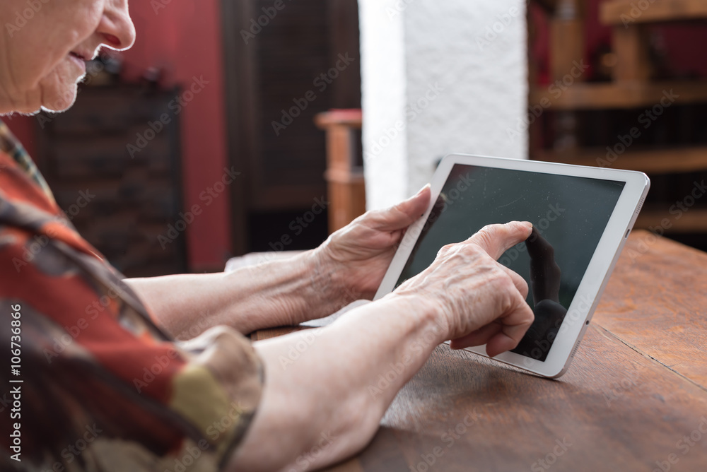 Senior woman using tablet