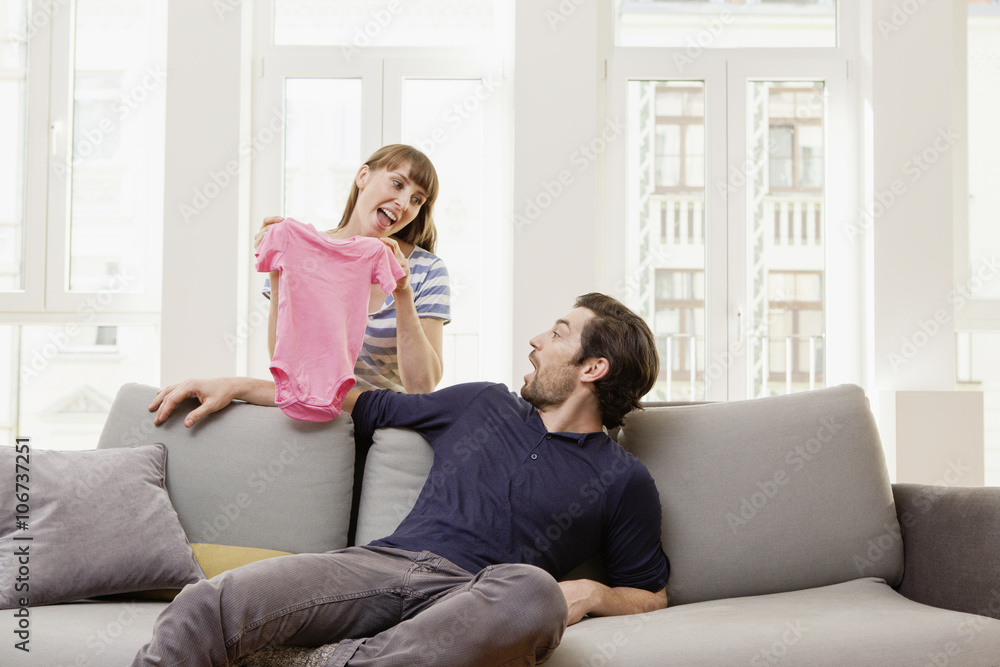Expectant parents with pink baby shirt Expectant parents with pink baby shirt