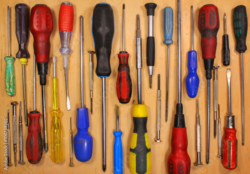 Many various old fashioned screwdrivers