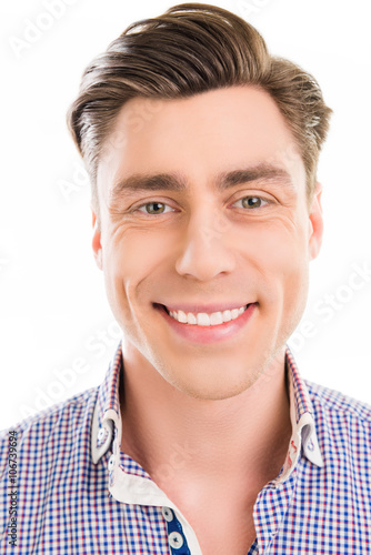 Close up photo of happy young man with beaming smile