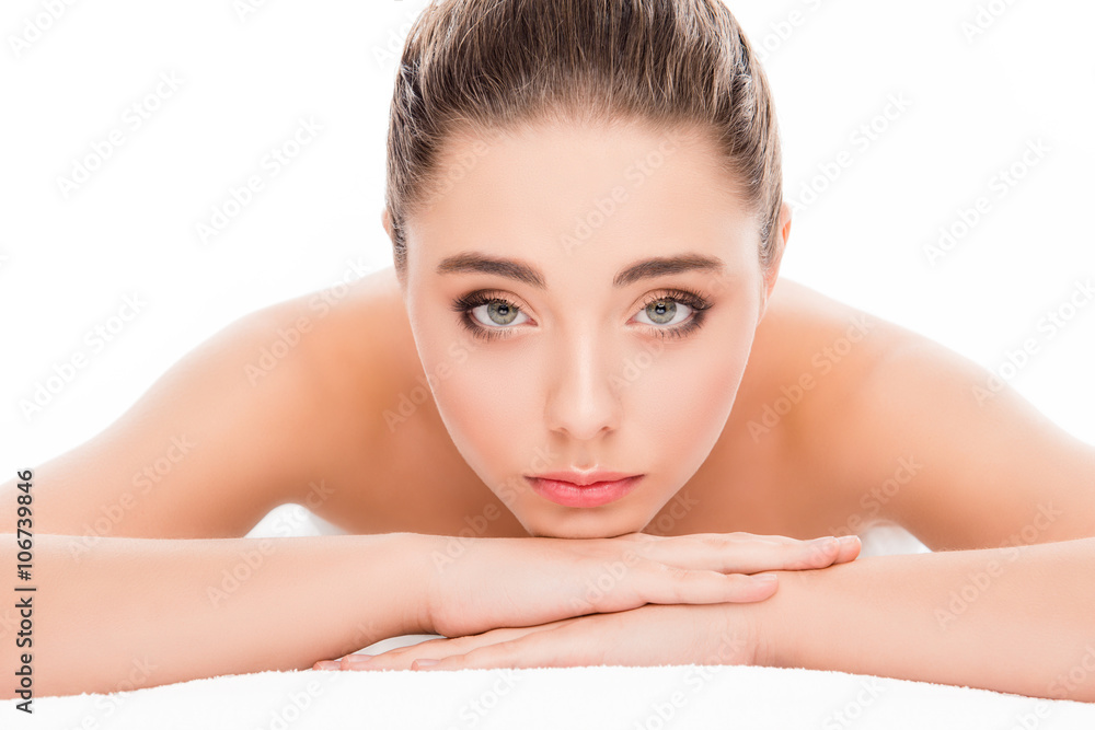 Attractive young woman lying in spa salon and relaxing Attractive young woman lying in spa salon and relaxing